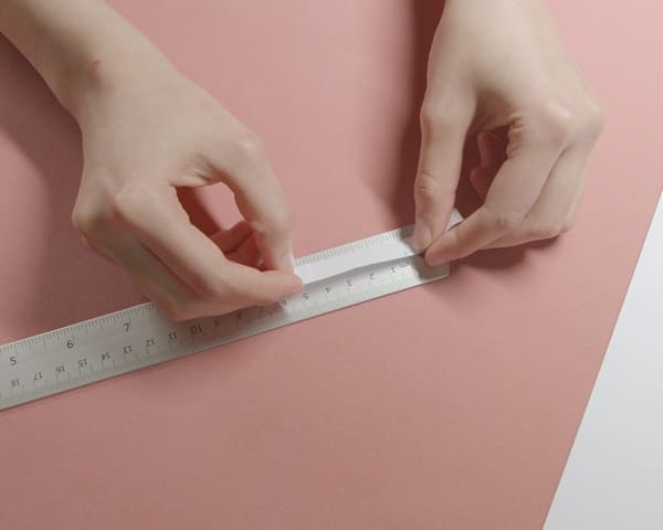 將紙片攤平，並用尺量出長度